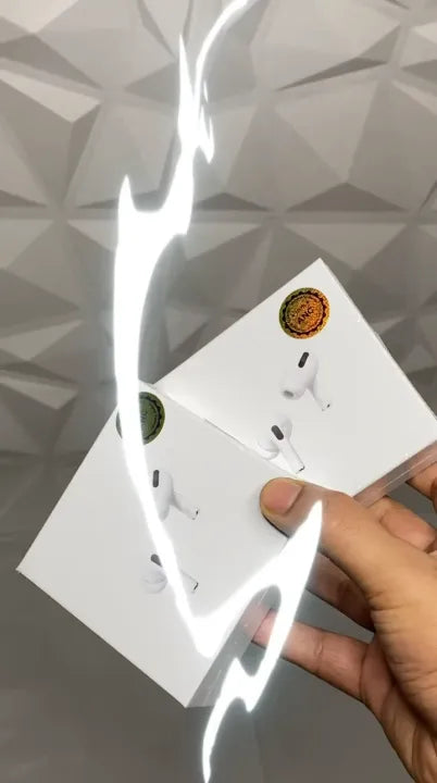 Hand holding a white electrical outlet with a geometric pattern in the background