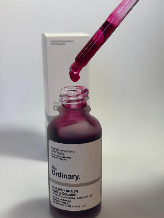 The Ordinary AHA BHA Peeling Solution red serum bottle used for exfoliation and acne mark treatment