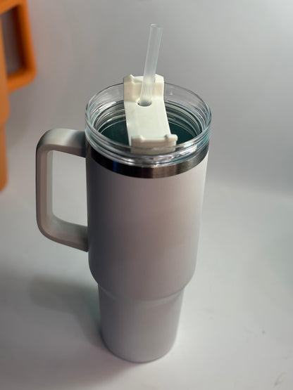 White insulated mug with handle and straw on a light gray background 40 oz stainless steel tumbler with straw and handle – leakproof insulated water bottle