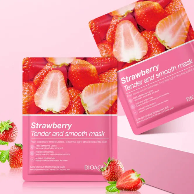 Strawberry-themed skincare mask packaging on a pink background