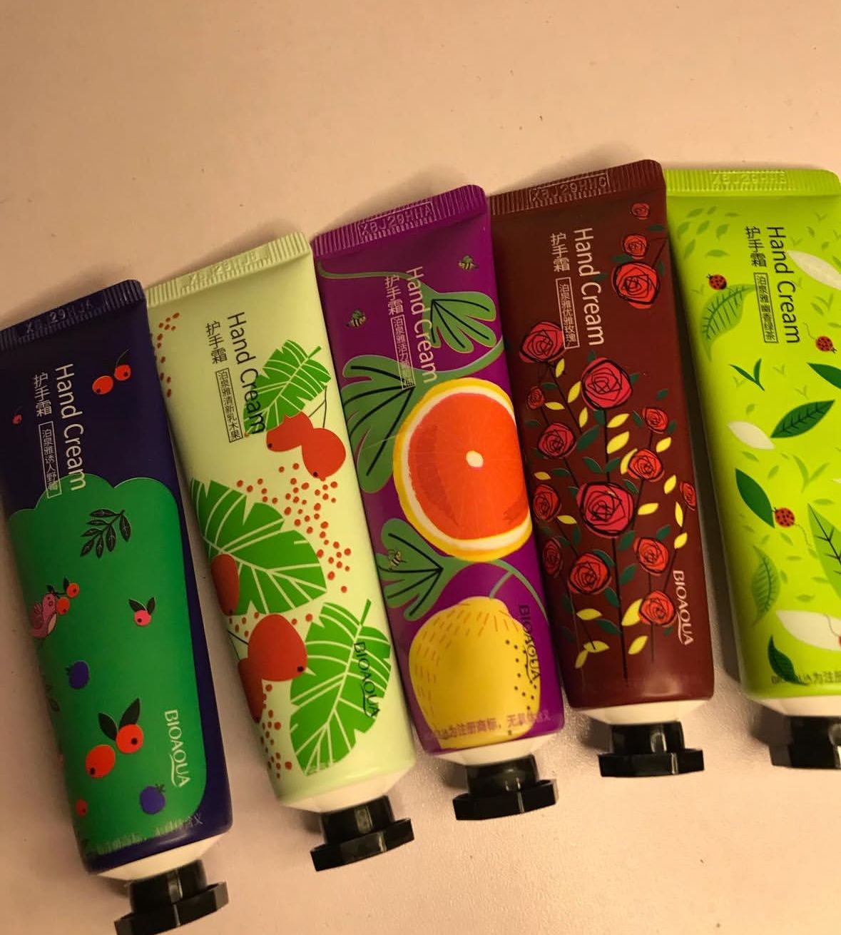 BIOAQUA hand cream set featuring five colorful tubes with fruity and floral designs, perfect for soft, smooth, and hydrated hands in winter and everyday use.
