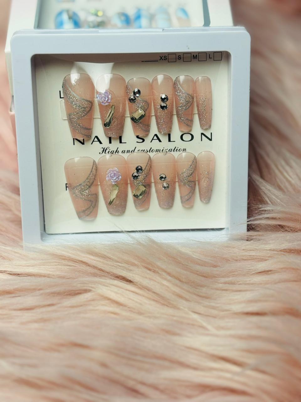 Nude brown press-on nails with subtle bead details, everyday elegant manicure by Amora Mega Store.
