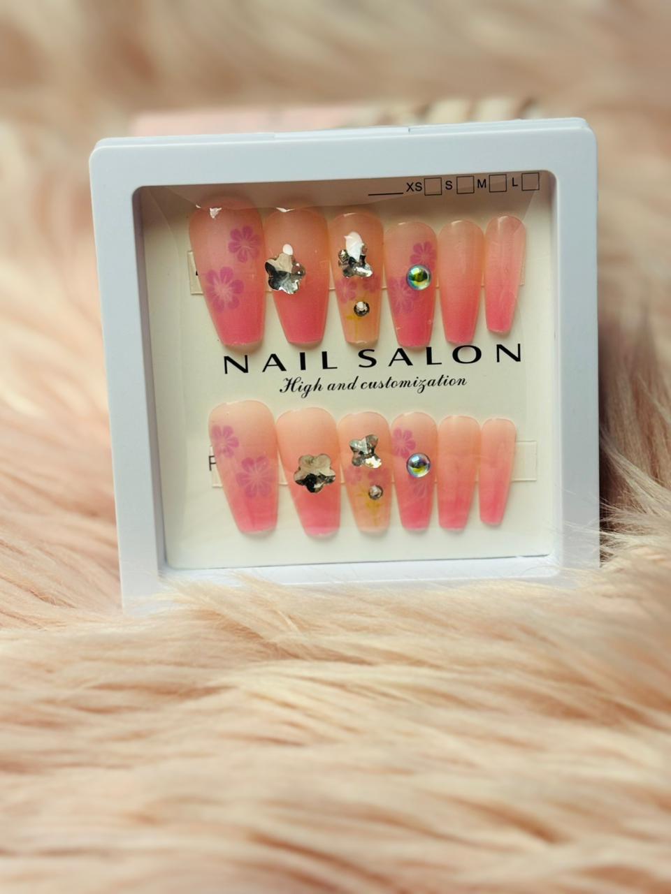  Pink beaded press-on nails with gemstone detail, stylish long coffin shape, Amora Mega Store collection.
