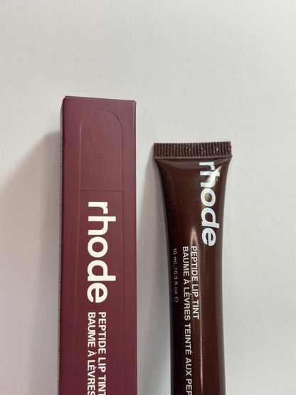 Rhode Peptide Lip Tint in Espresso – deep brown hydrating lip tint with peptide formula and glossy finish.”
“Rhode Espresso lip tint – rich brown peptide-infused lip care, moisturizing and smooth.