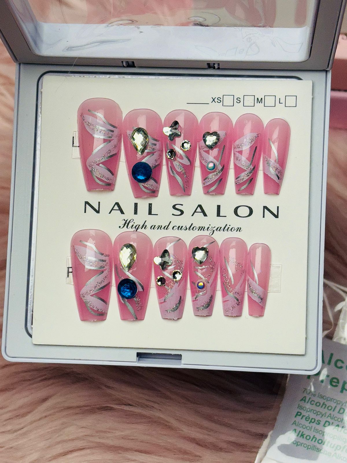 Hot pink and white press-on nails with heart beaded accents, cute romantic nail design from Amora Mega Store.
