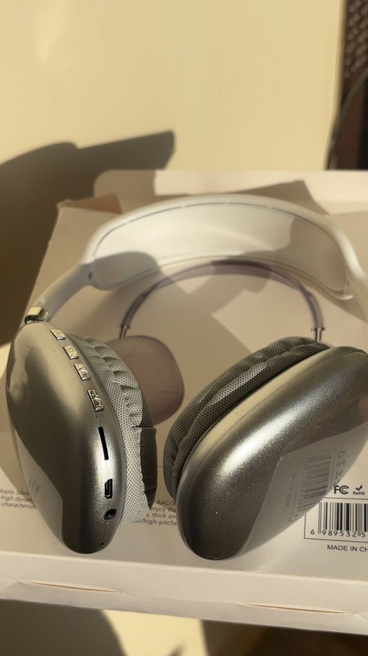 Pair of headphones on a reflective surface with a neutral background P9 Wireless Bluetooth Headphones with Microphone – Noise Cancelling