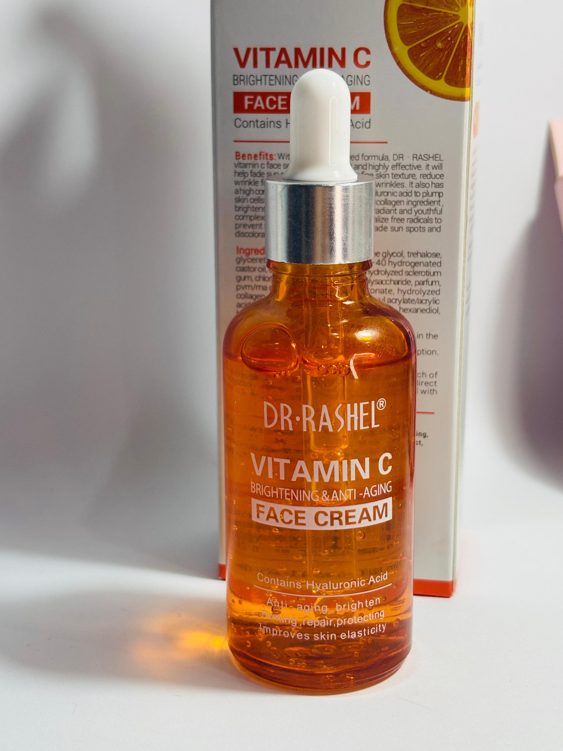 Dr. Rashel Vitamin C face cream bottle with packaging in the Vitamin C face serum 50ml pump bottle – antioxidant brightening serumbackground