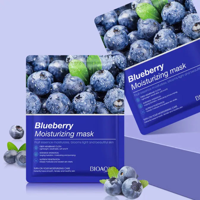 Blueberry moisturizing mask packaging with blueberries and green leaves on a purple background